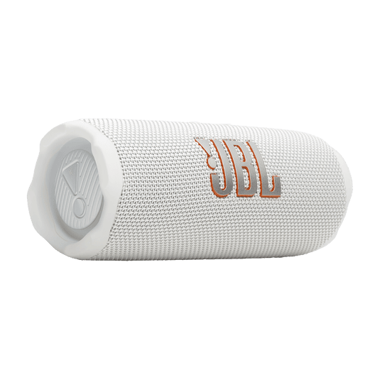 JBL Flip 7 לבן מונח על שולחן מודרני